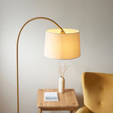 Warm brass plate & natural fabric
