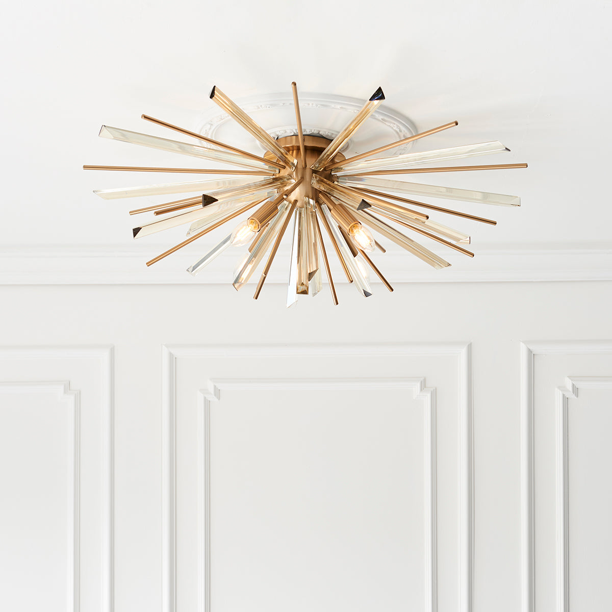 Juno Flush Starburst Ceiling Light in Antique Brass